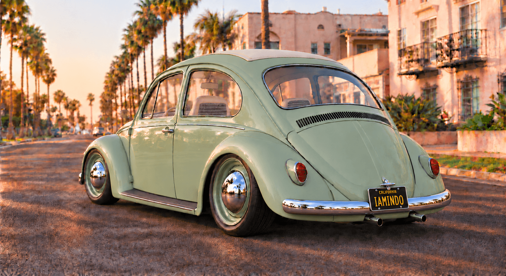 The pistachio Bug from the rear three-quarter on a palm-lined street: body-color roof with an ivory ragtop, chrome blade bumper and a black California IAMINDO plate